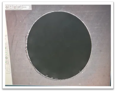 Hole in 60 HRC H13 steel before UBURR deburring, with burr