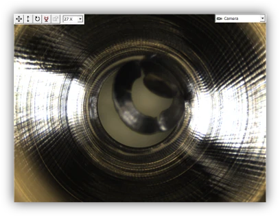 Rear of 17-4 PH drill hole before UBURR deburring, with burr