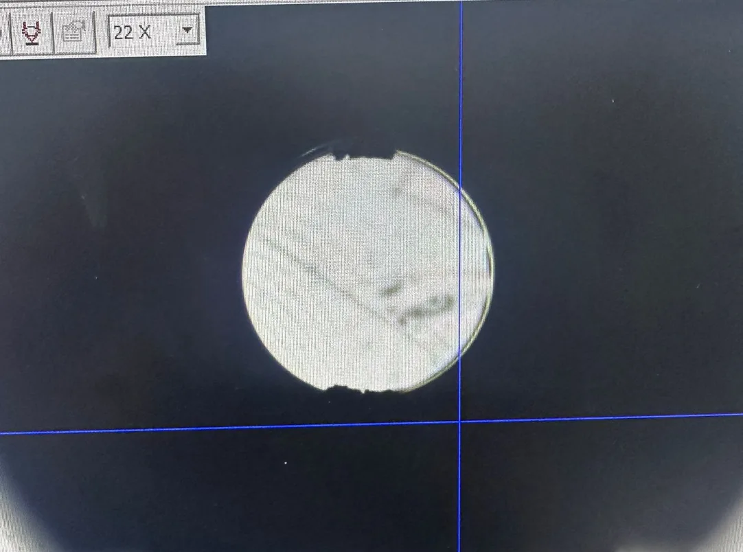 Cross-hole and M3 thread intersection before UFIBER deburring, with burr