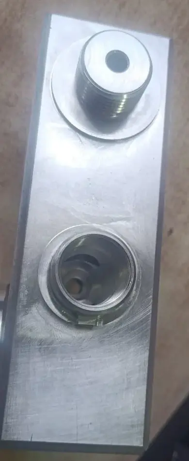 Aluminum application component showing the entry bore and machined features
