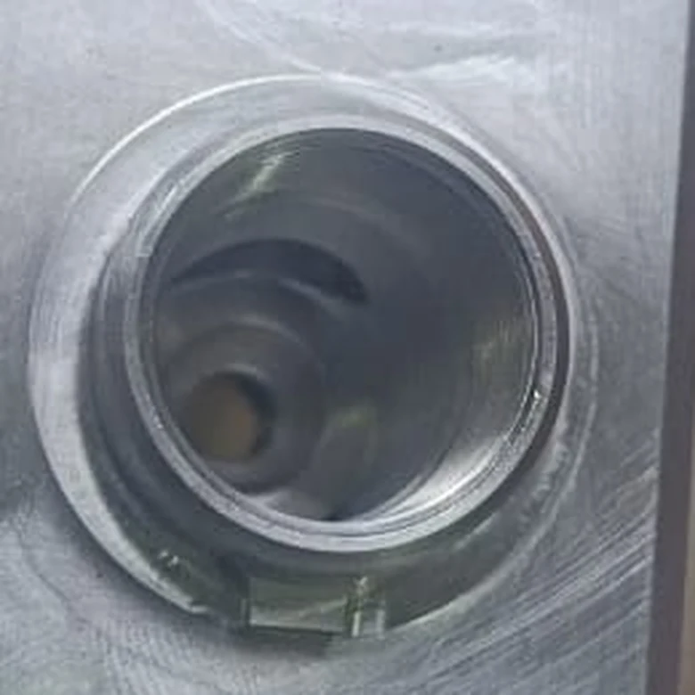 Bore detail after the UF2670 deburring trial, rotated counterclockwise to align with the before view
