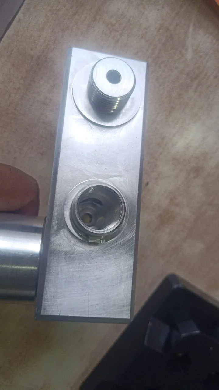 Full supplied after photograph showing the aluminum component and deburred bore
